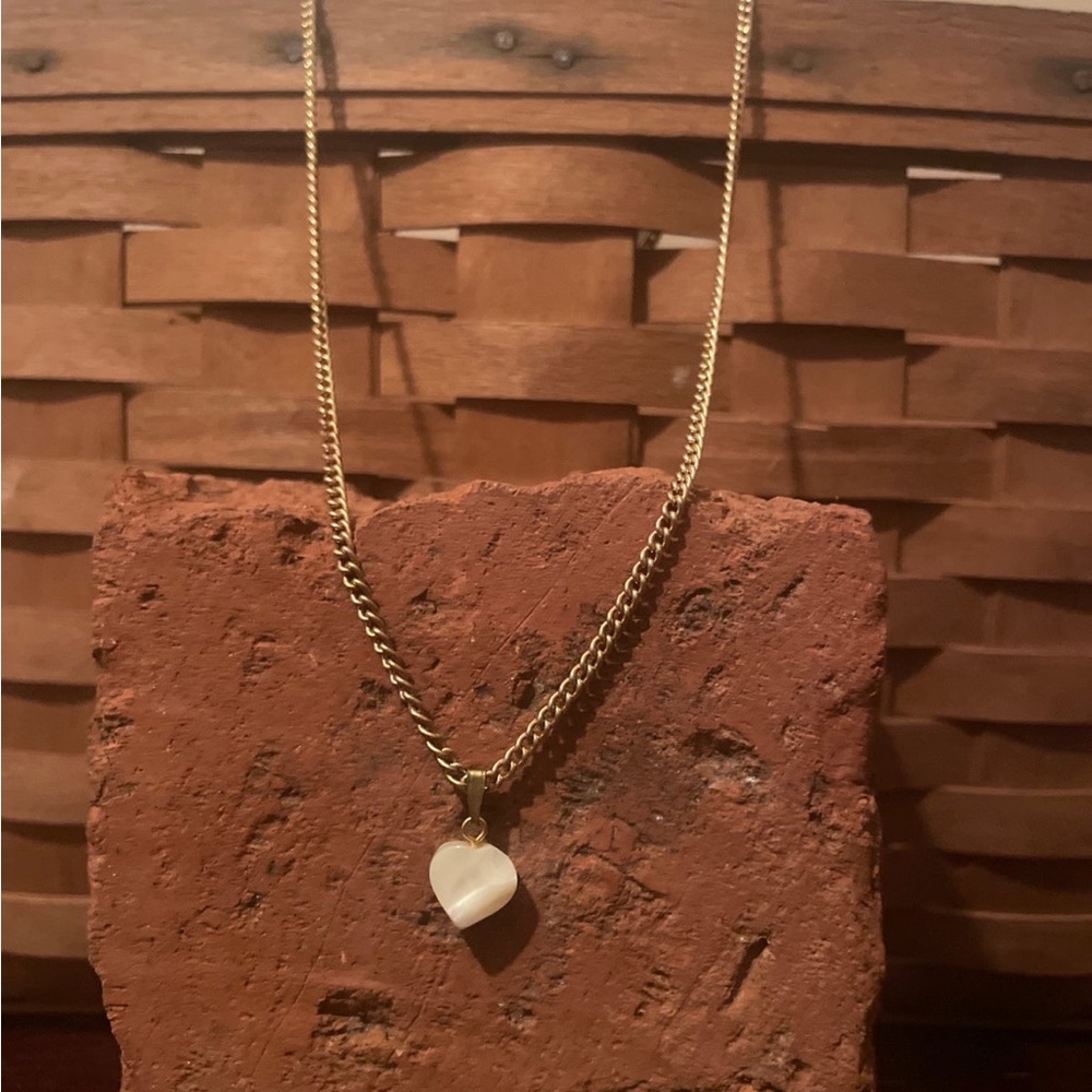 Heart shaped pendant carved from stone rose quartz Beautiful pendant.